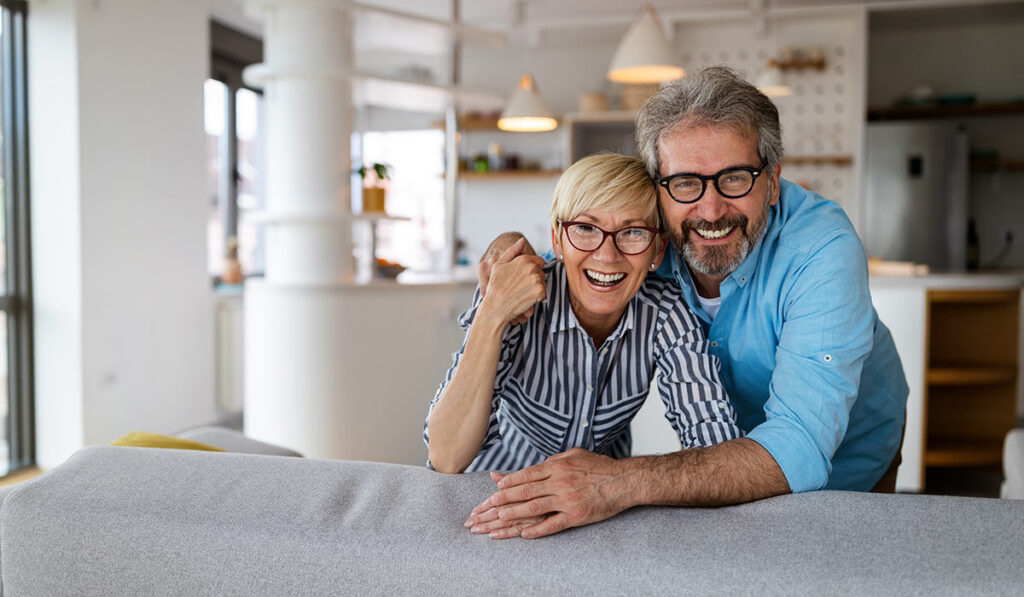 Couple inside house happy